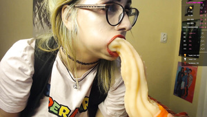 Busty blonde sucking weird anal toys on webcam