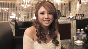 Beautiful babe in a sexy dress talks with a dude in a club