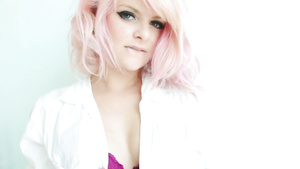 Tattooed girl in denim shorts getting naked in hot solo show