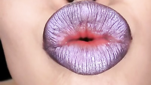 Beautiful Japanese babe with juicy lips poses on camera