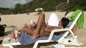 young shameless lesbians making out on public beach outdoors