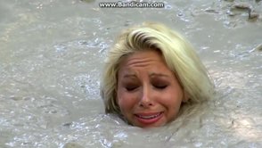 Bizarre Fetish Scene Featuring Busty Blonde Sinks In Lake Of Dirt ...