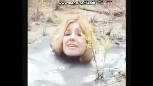 Crazy Bizarre Fetish Fully Clothed MILF In Big Puddle Of Liqued Dirt