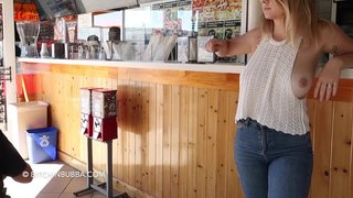 She shows her big tits in the bar / Xozilla.com