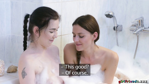 Lesbian girlfriends Daphne and Kira get naughty in the tub.