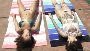 Tattooed lesbian with hairy pussy meets a hot girl on vacation