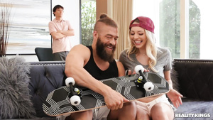 Adorable skater girl pleasuring Xander in the living room