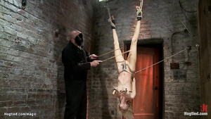 Skinny blond hair babe in upside down suspension